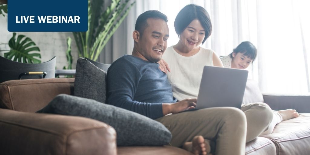 Young Asian family using the laptop and spending time together at home.